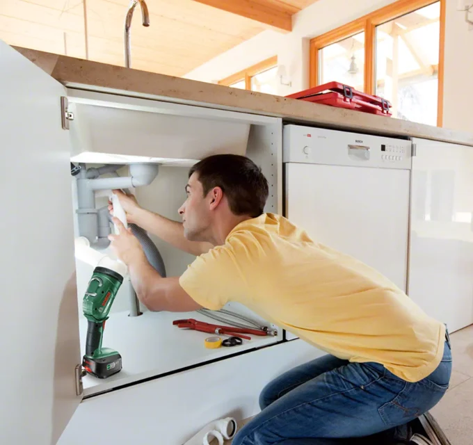 Man repairing sink